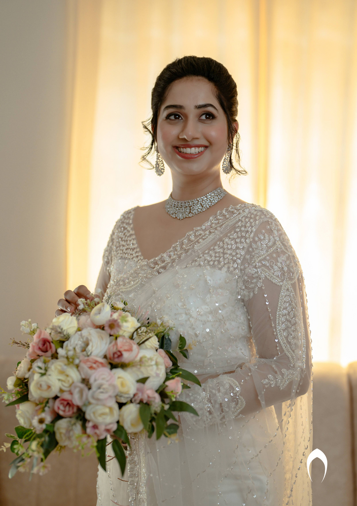 Signature Christian bridal off-white saree with heavy hand embroidery