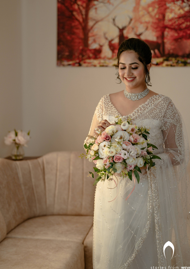 Signature Christian bridal off-white saree with heavy hand embroidery