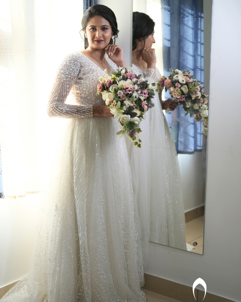 Signature christian bridal Aline gown featuring intricate handwork with beads and pearls