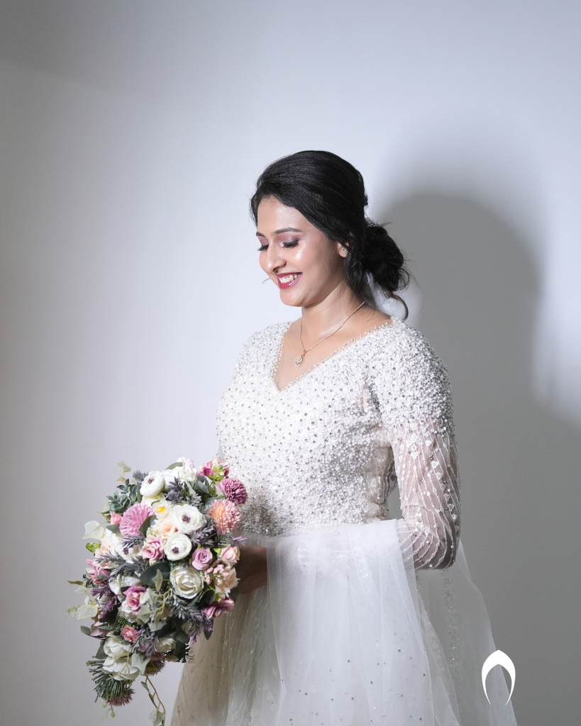 Signature christian bridal Aline gown featuring intricate handwork with beads and pearls