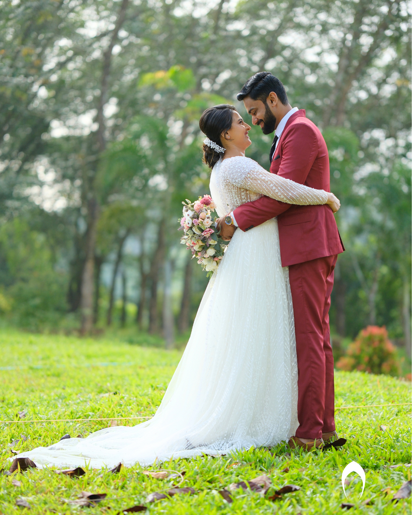 Signature christian bridal Aline gown featuring intricate handwork with beads and pearls