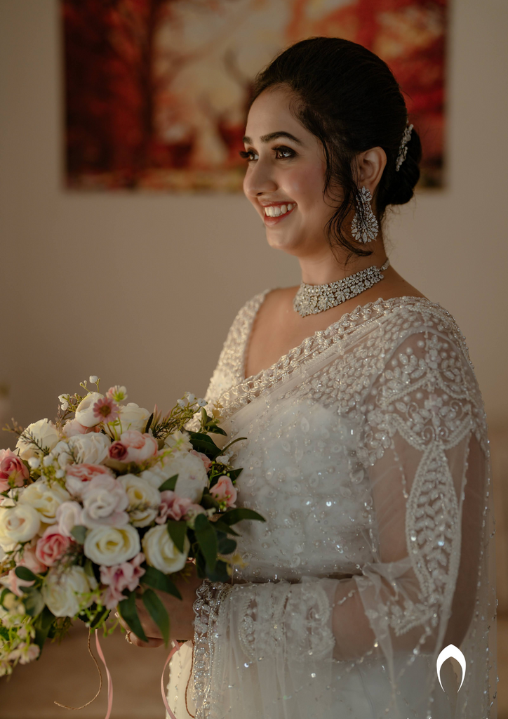 Signature Christian bridal off-white saree with heavy hand embroidery