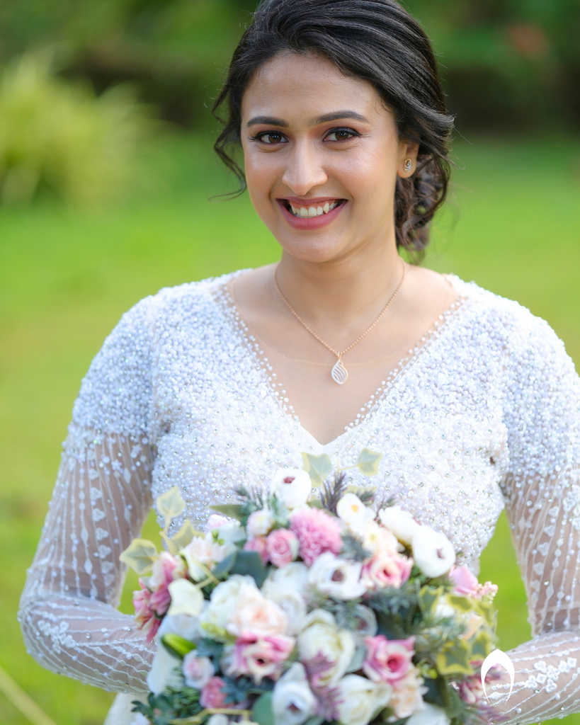 Signature christian bridal Aline gown featuring intricate handwork with beads and pearls