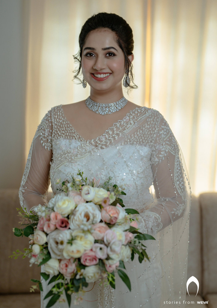 Signature Christian bridal off-white saree with heavy hand embroidery