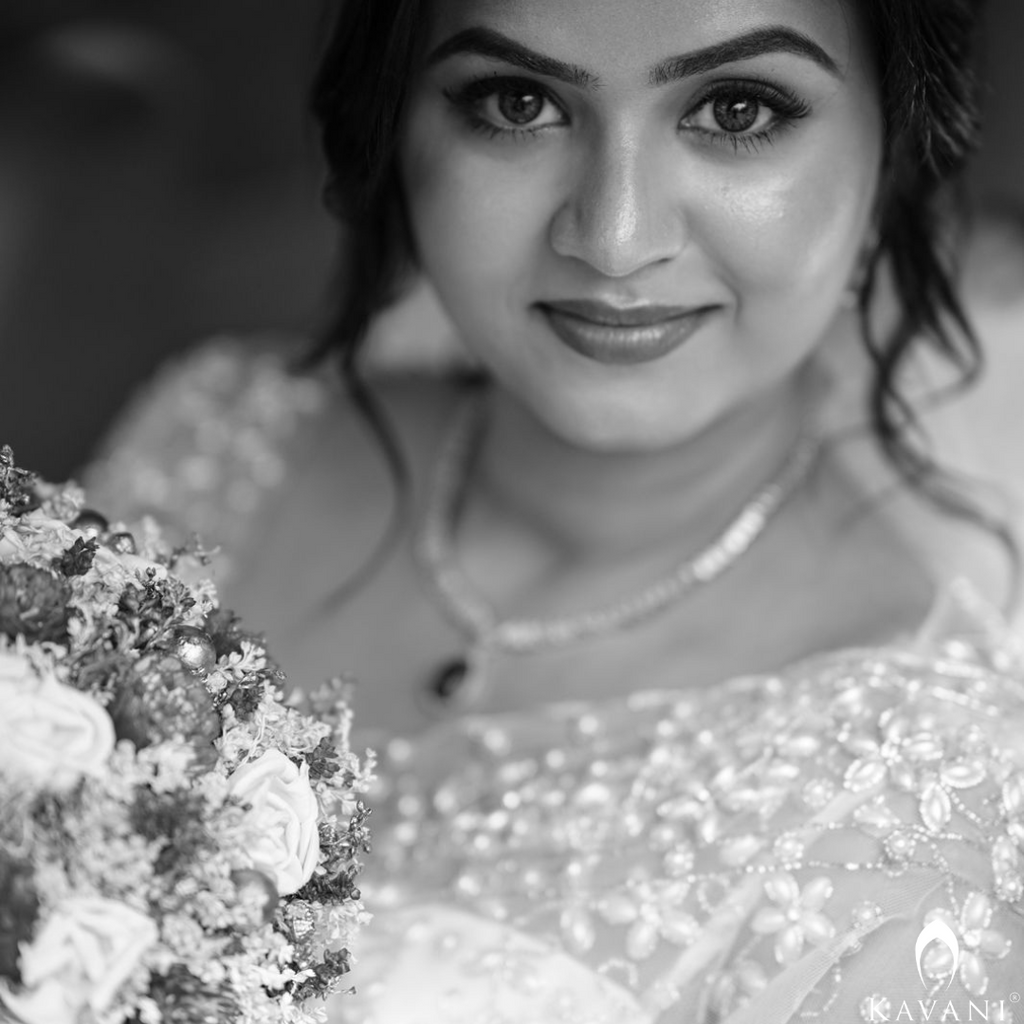 Our beautiful bride in her white bridal saree and elegant and stunning hand embroidery