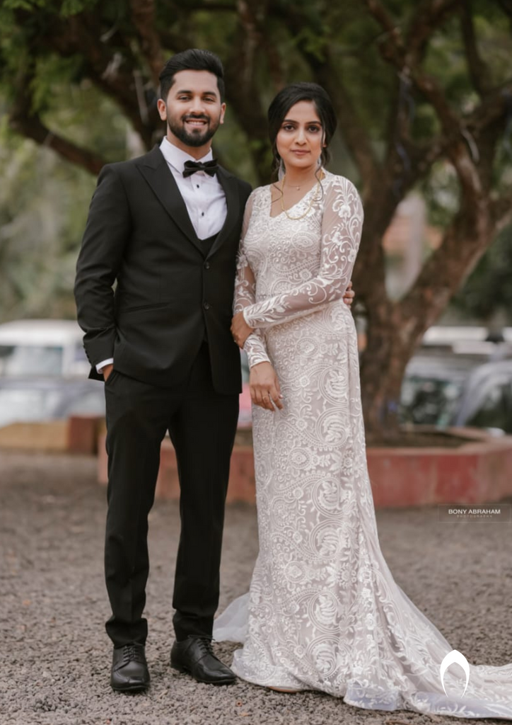 Signature christian bridal trailing champagne gown carried by bride Anuja