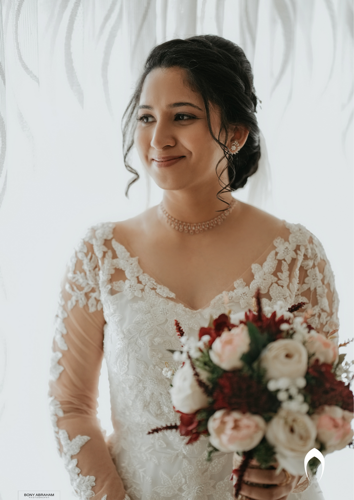 Signature christian bridal A-line gown with an illusion V neck
