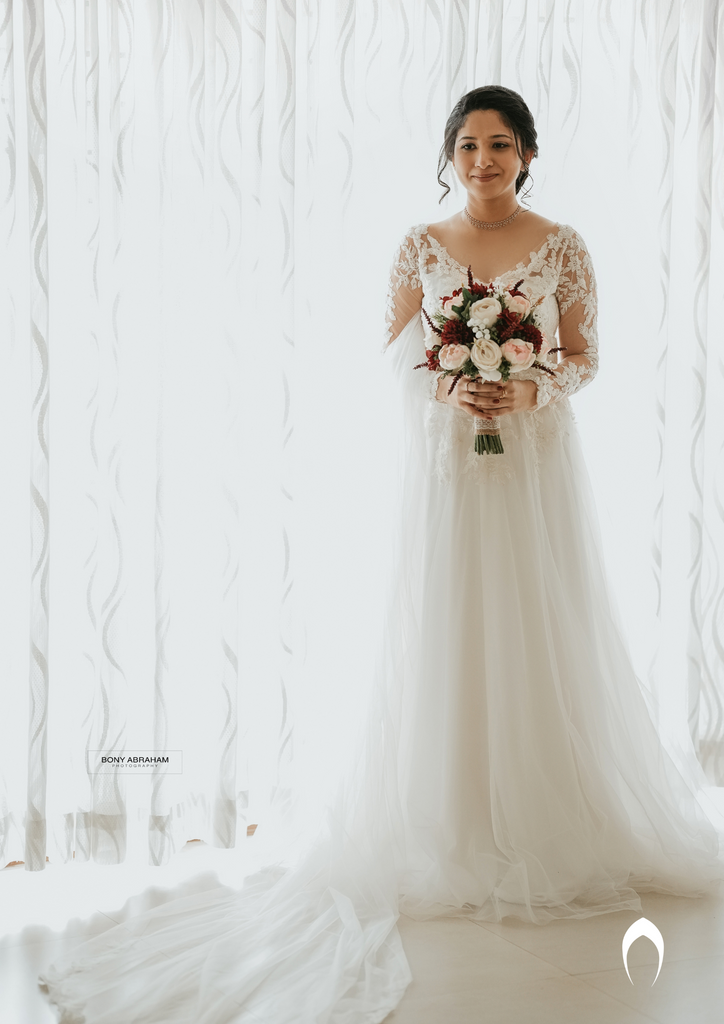 Signature christian bridal A-line gown with an illusion V neck