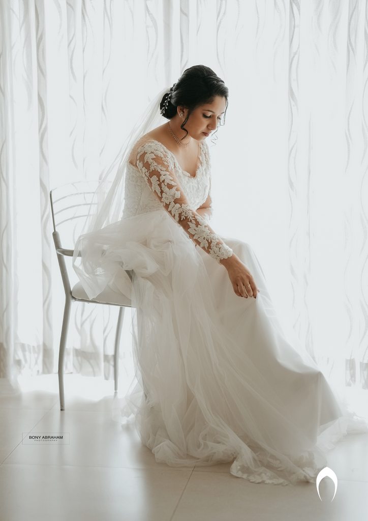 Signature christian bridal A-line gown with an illusion V neck