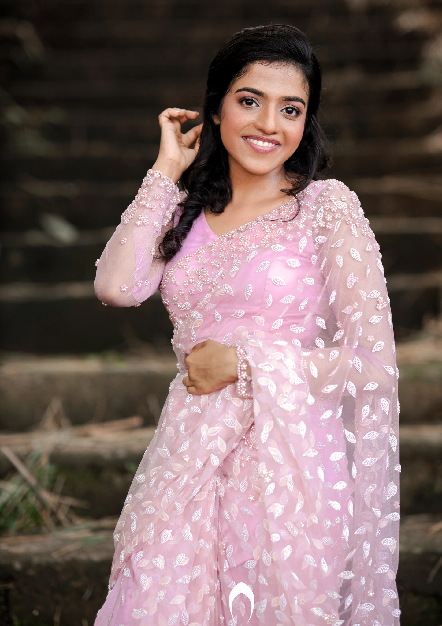 Signature Christian bridal saree in pink embellished net
