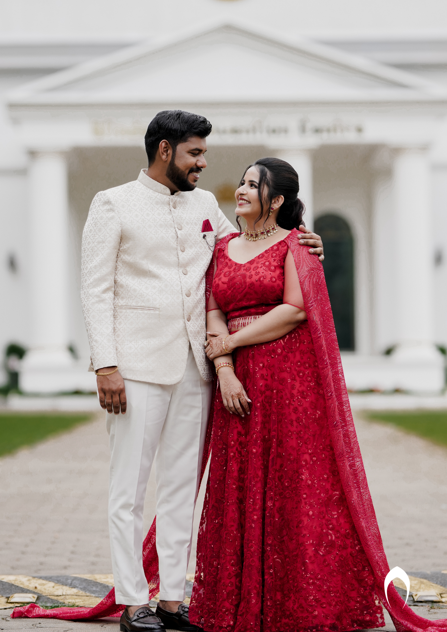 Signature bridal lehanga in bright red with trailing sleeve