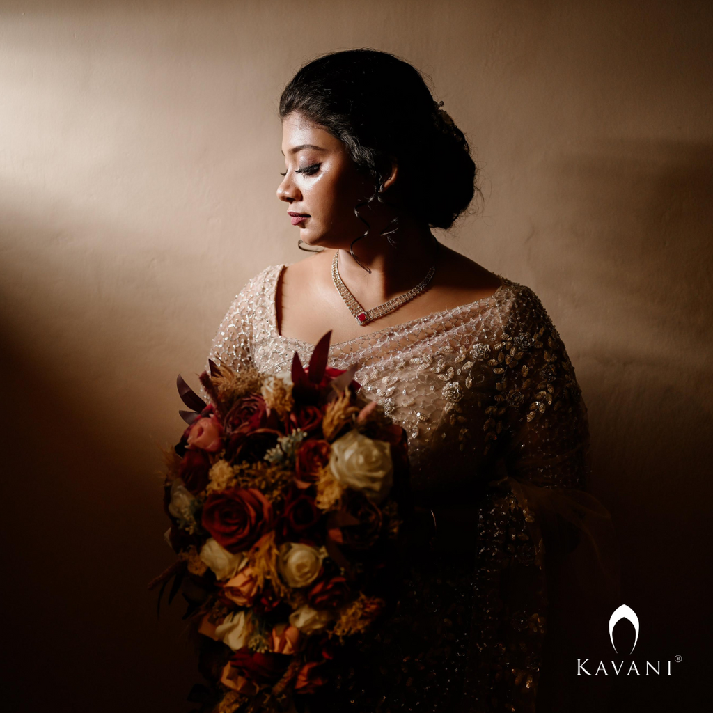 Beautiful bride in her stunning looking bridal saree with lace and hand embroidery