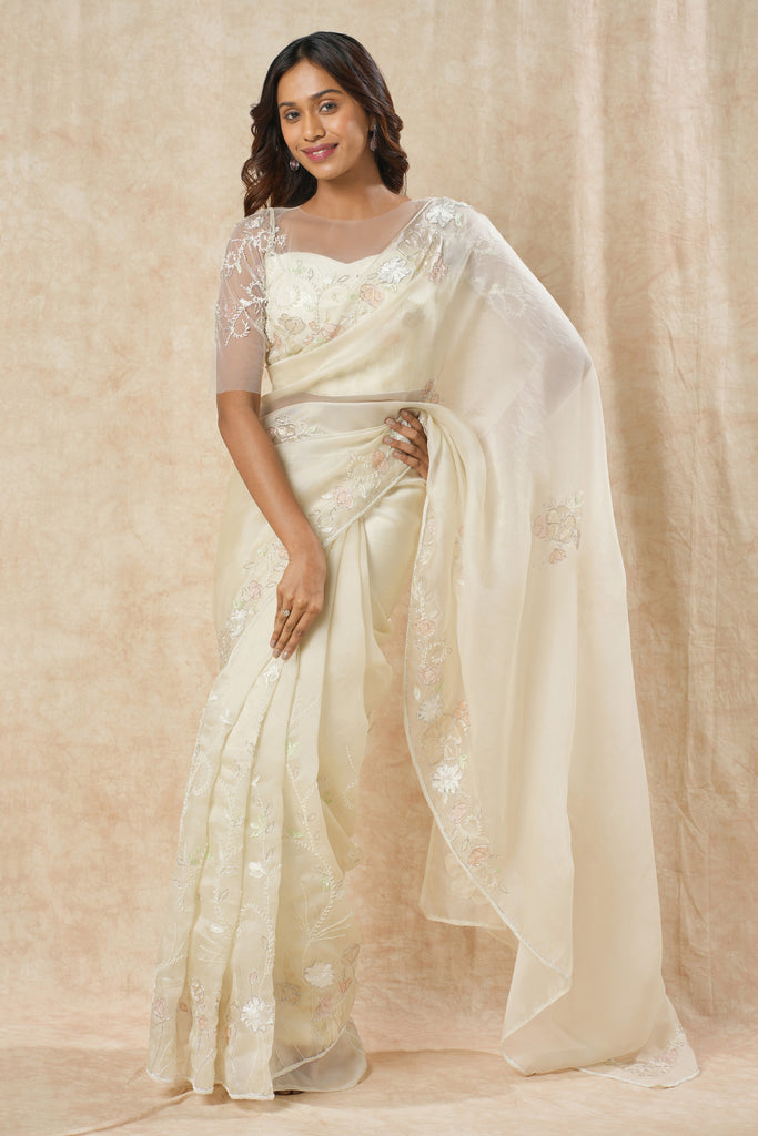 Off-White Organza Saree with Floral Appliqué, Bead Embellishments, and Embroidered Elbow Sleeve Blouse