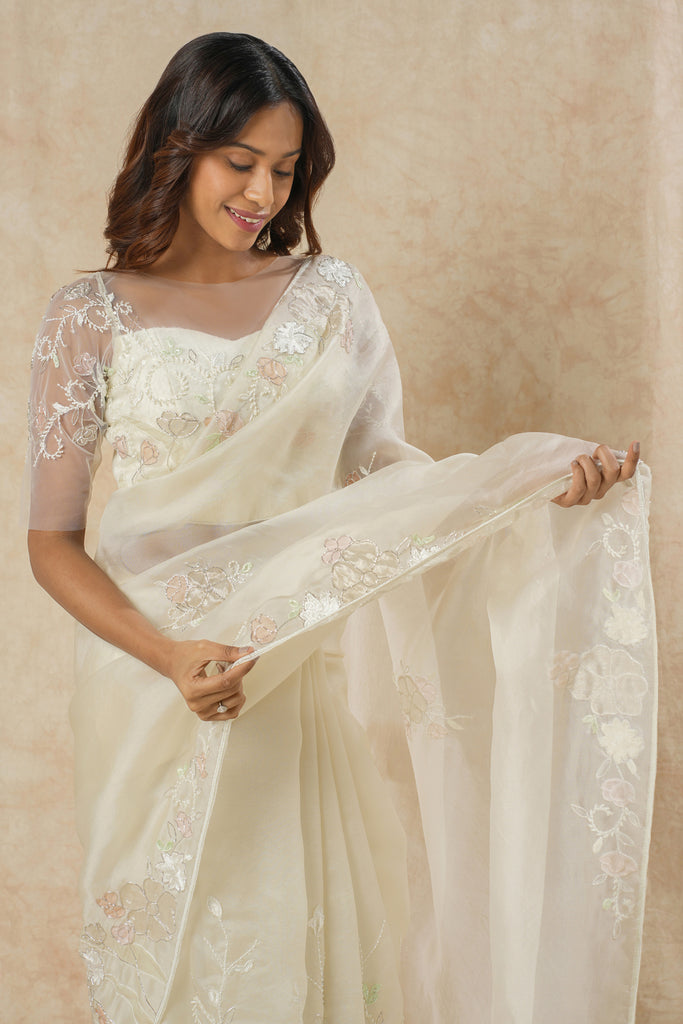 Off-White Organza Saree with Floral Appliqué, Bead Embellishments, and Embroidered Elbow Sleeve Blouse