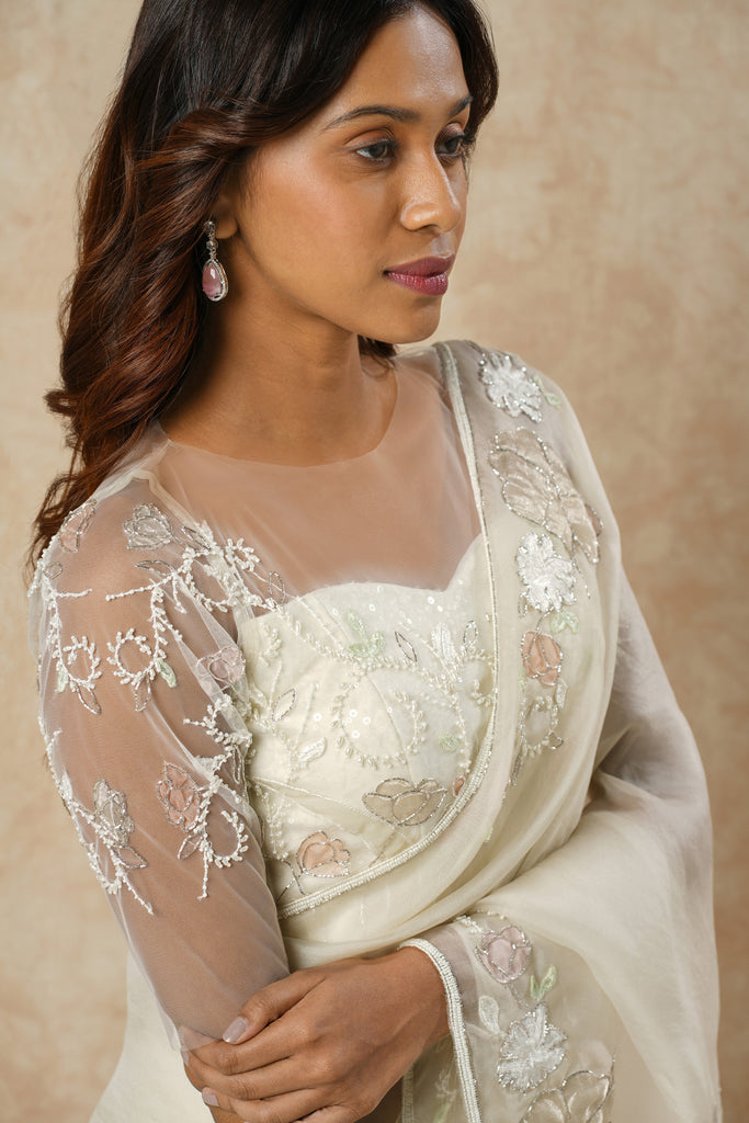 Off-White Organza Saree with Floral Appliqué, Bead Embellishments, and Embroidered Elbow Sleeve Blouse
