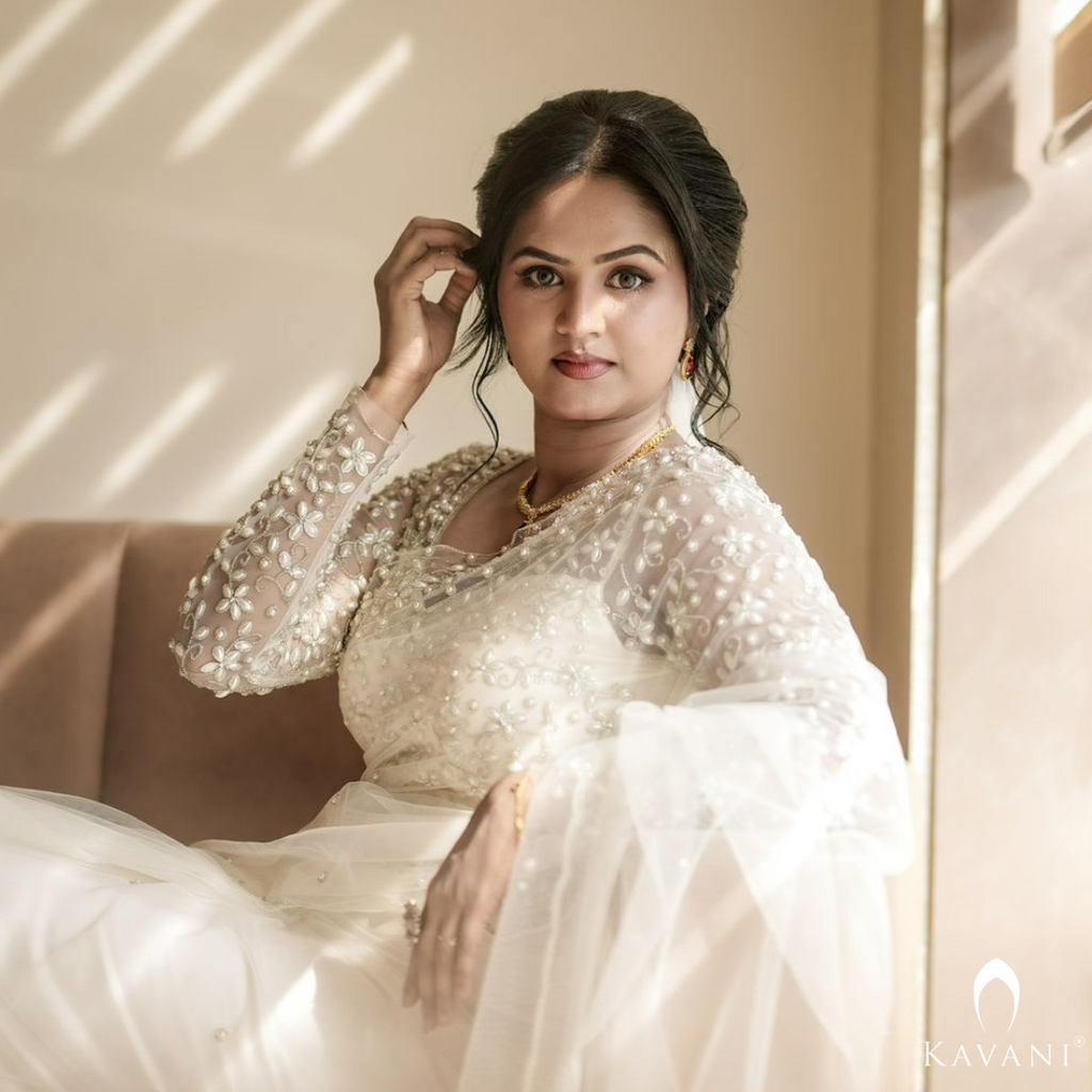 Our beautiful bride in her white bridal saree and elegant and stunning hand embroidery