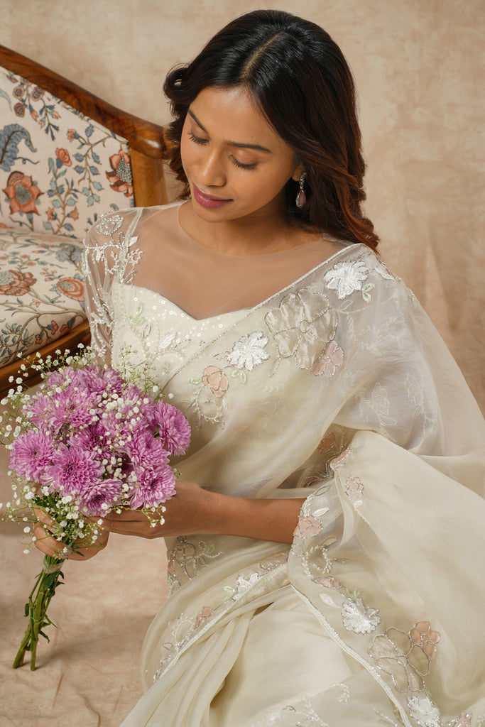 Off-White Organza Saree with Floral Appliqué, Bead Embellishments, and Embroidered Elbow Sleeve Blouse
