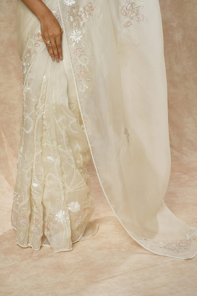 Off-White Organza Saree with Floral Appliqué, Bead Embellishments, and Embroidered Elbow Sleeve Blouse