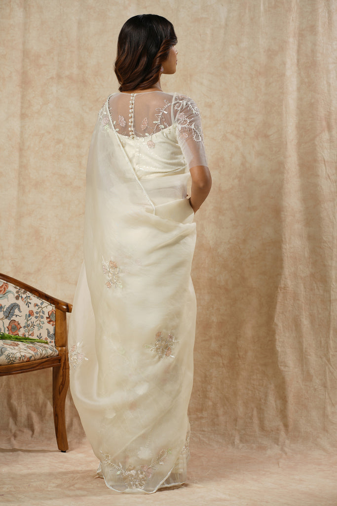 Off-White Organza Saree with Floral Appliqué, Bead Embellishments, and Embroidered Elbow Sleeve Blouse