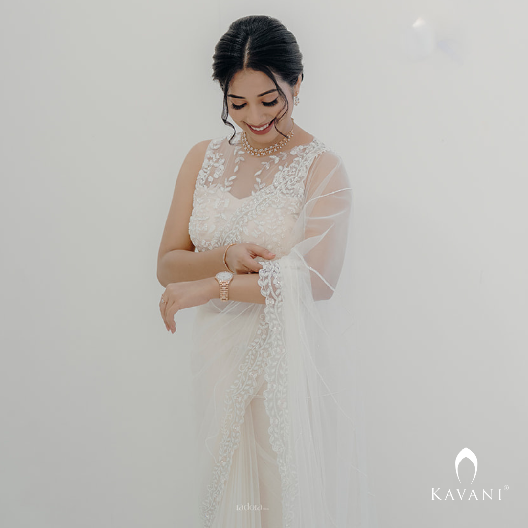 Beautiful and elegant white bridal saree with very class hand embroidery of unique statement piece