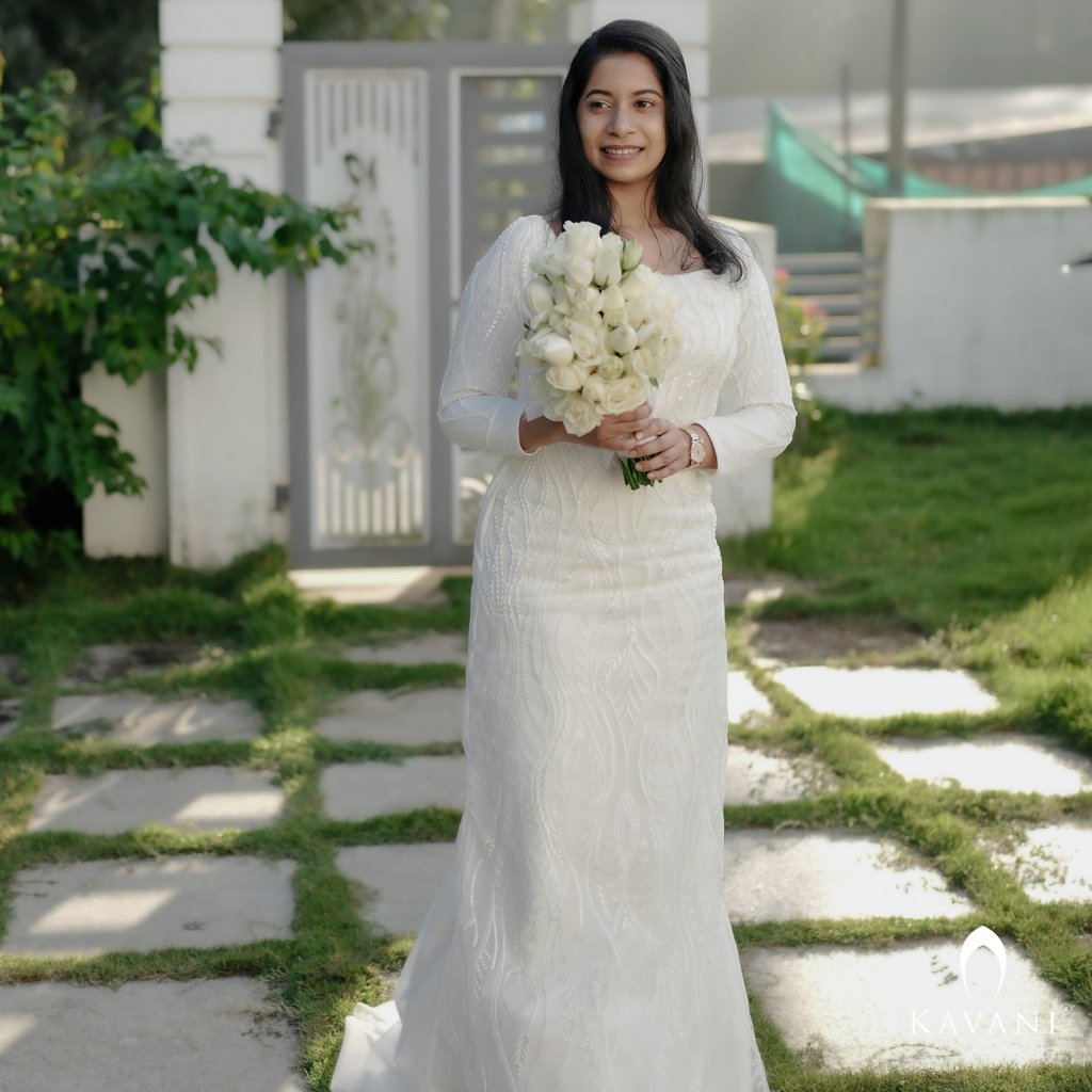 White bridal mermaid gown with beautiful lace work