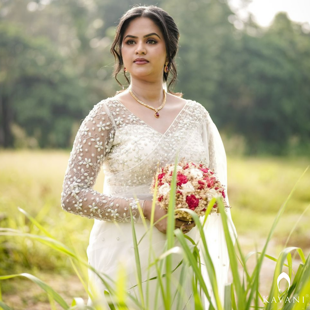 Our beautiful bride in her white bridal saree and elegant and stunning hand embroidery