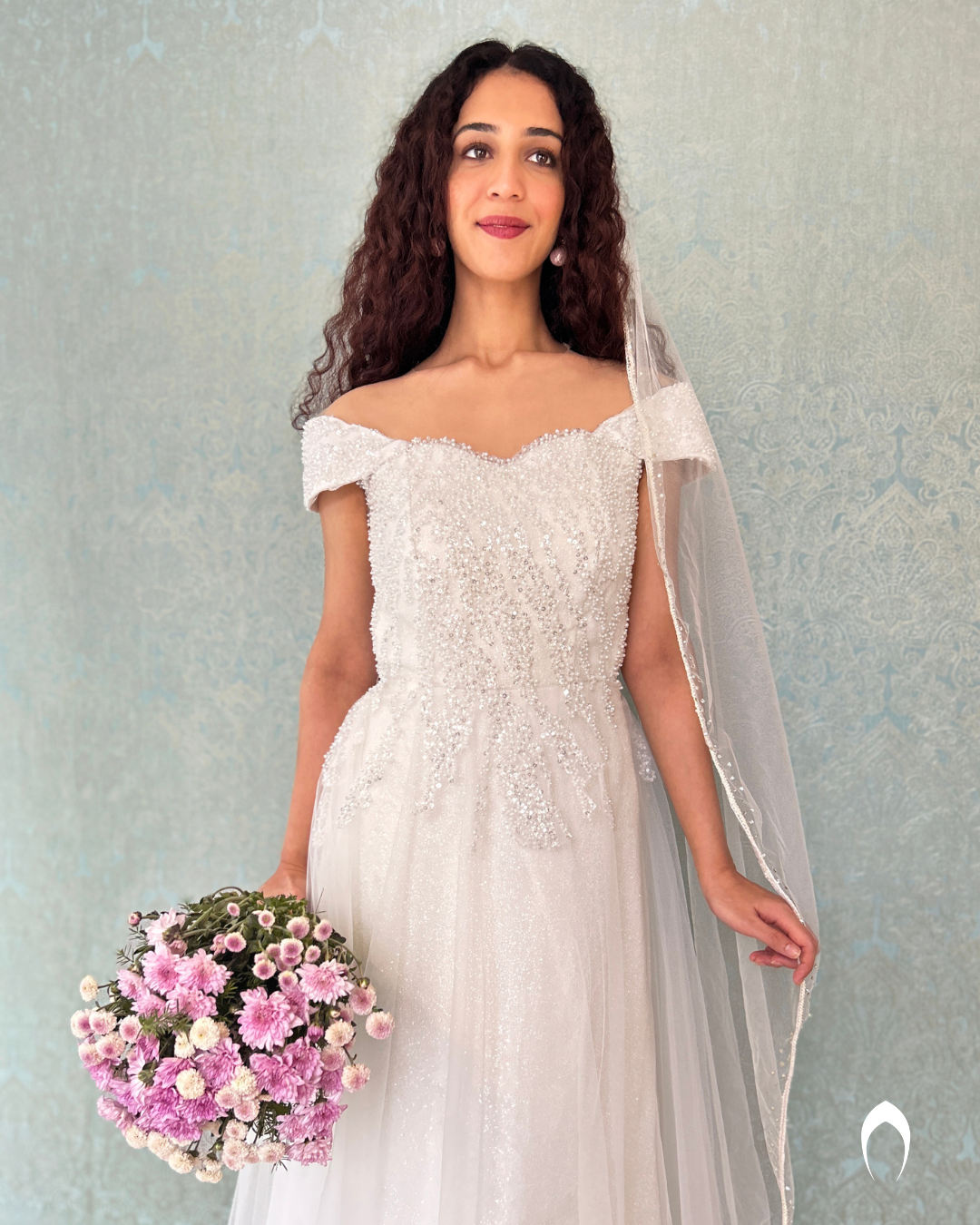 Signature christian Aline gown in net with glitz and embellished with sugar beads