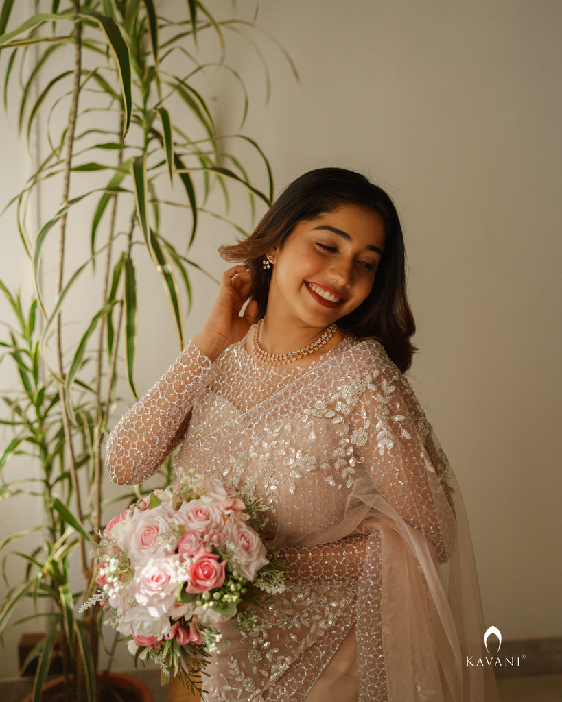Wedding saree in a dusty nude pink shade with beautiful handwork