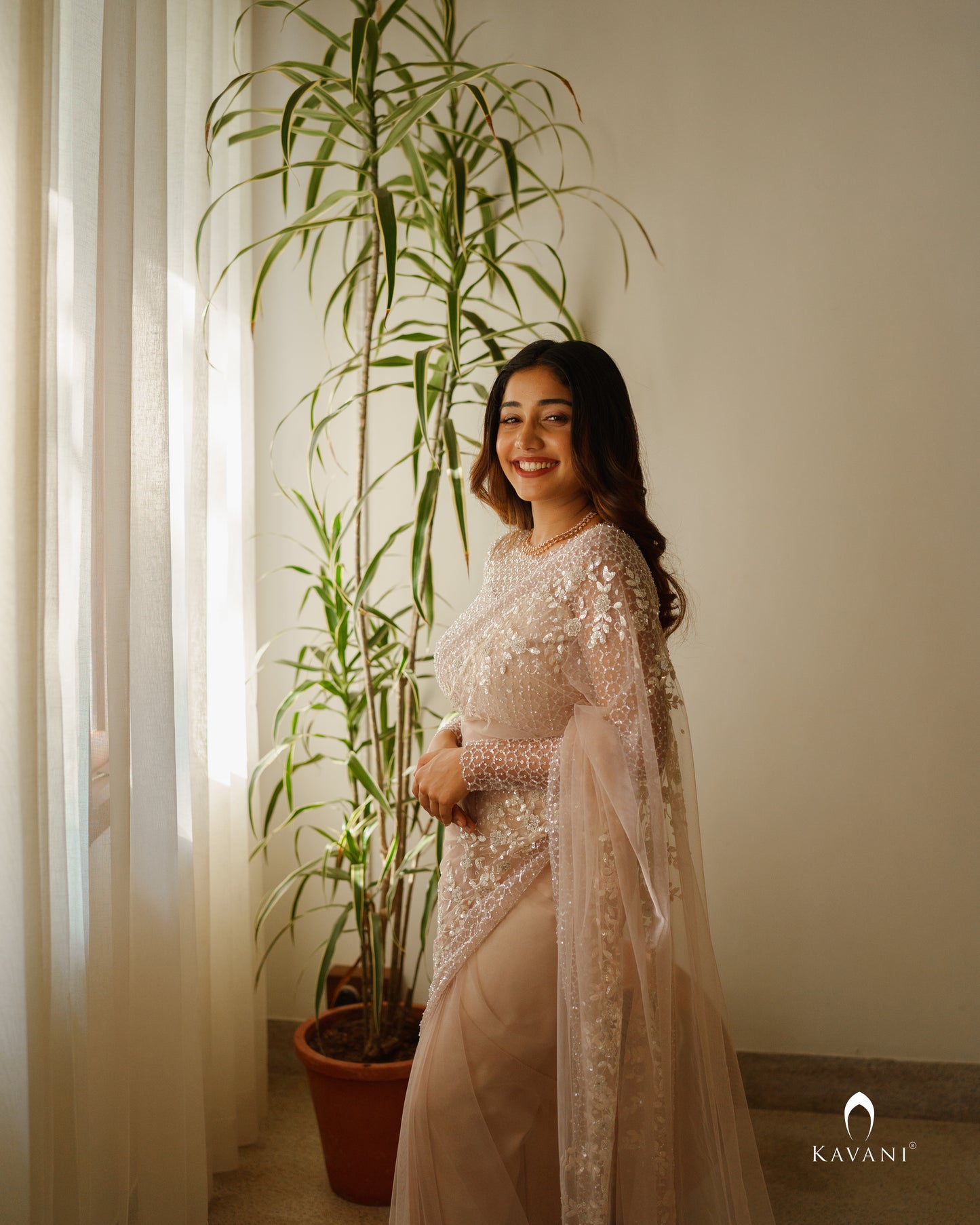 Wedding saree in a dusty nude pink shade with beautiful handwork