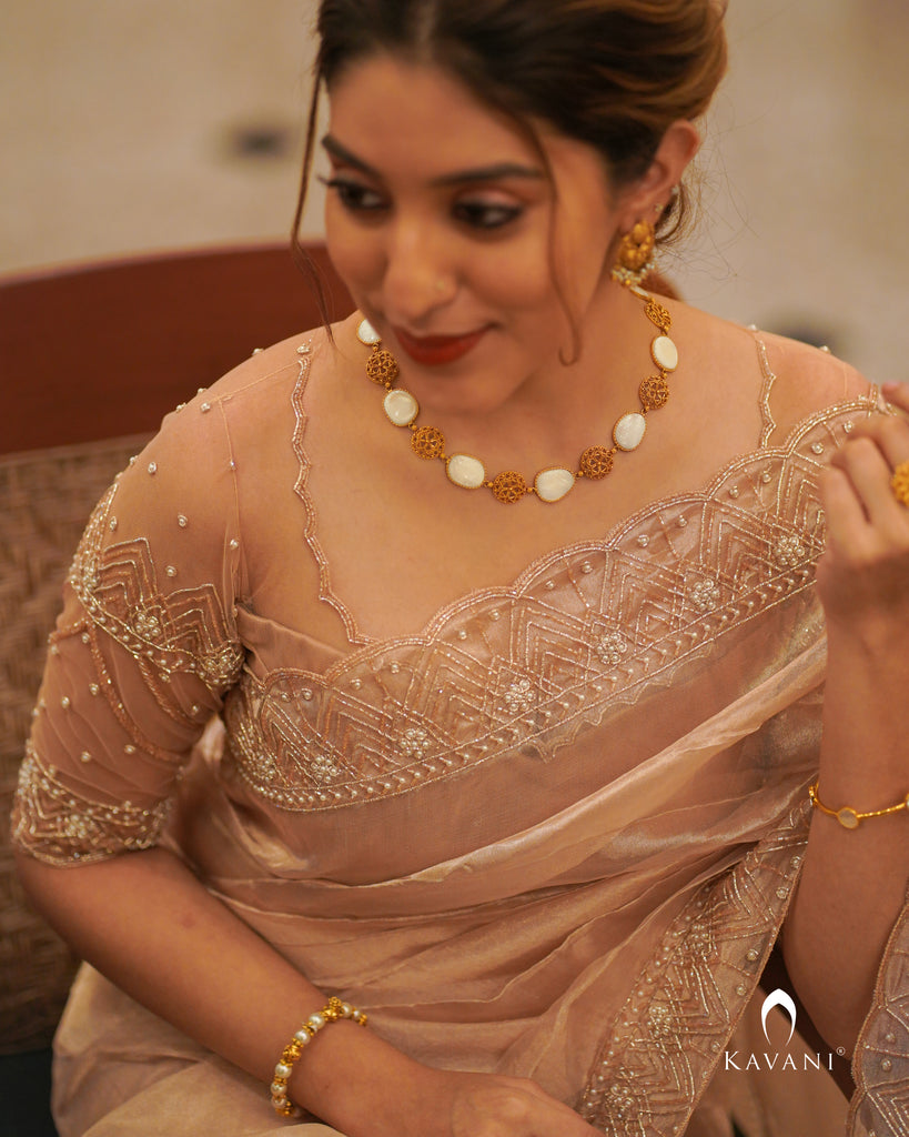 Signature Rose gold tissue saree with stylished pattern blouse