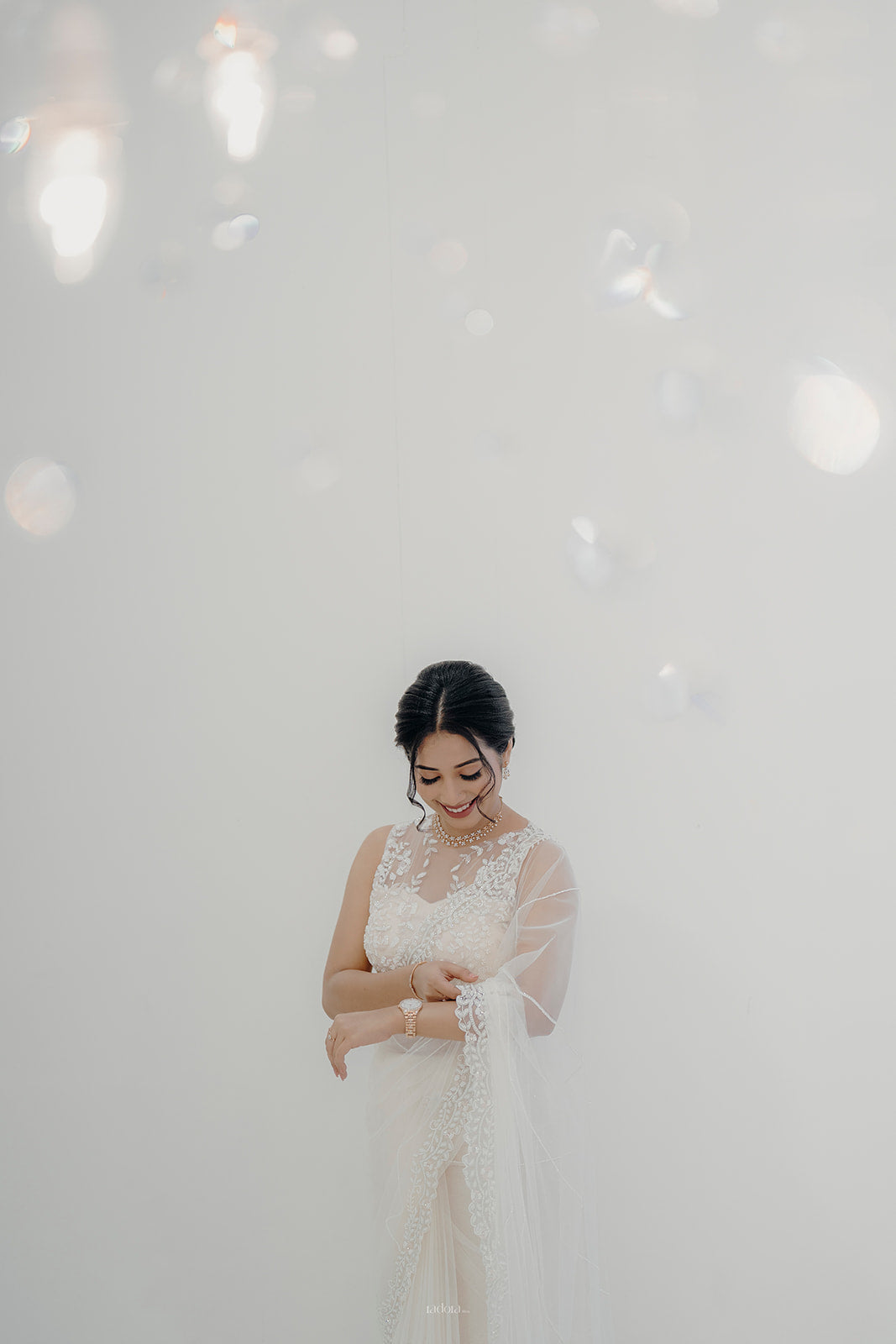 Beautiful and elegant white bridal saree with very class hand embroidery of unique statement piece