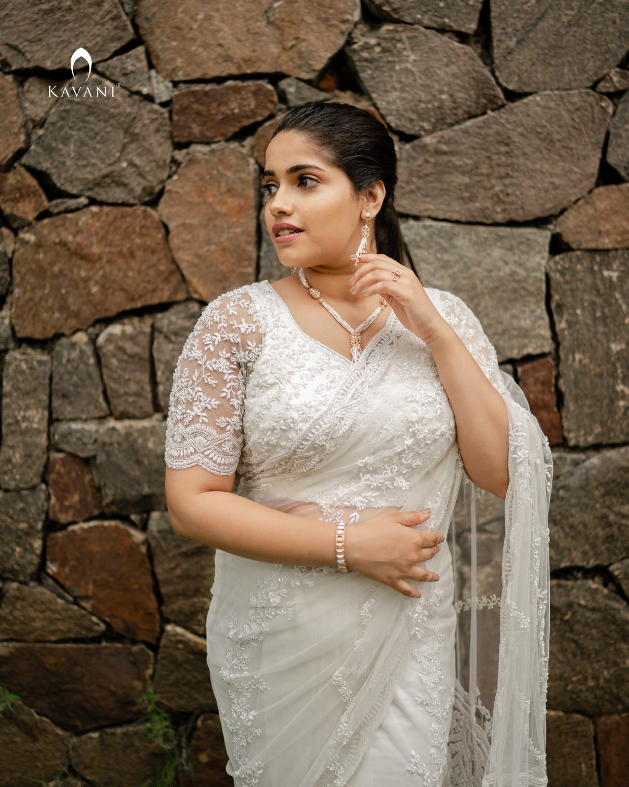 Our signature stunning white bridal saree showing beautiful lace embroidery with embellishments
