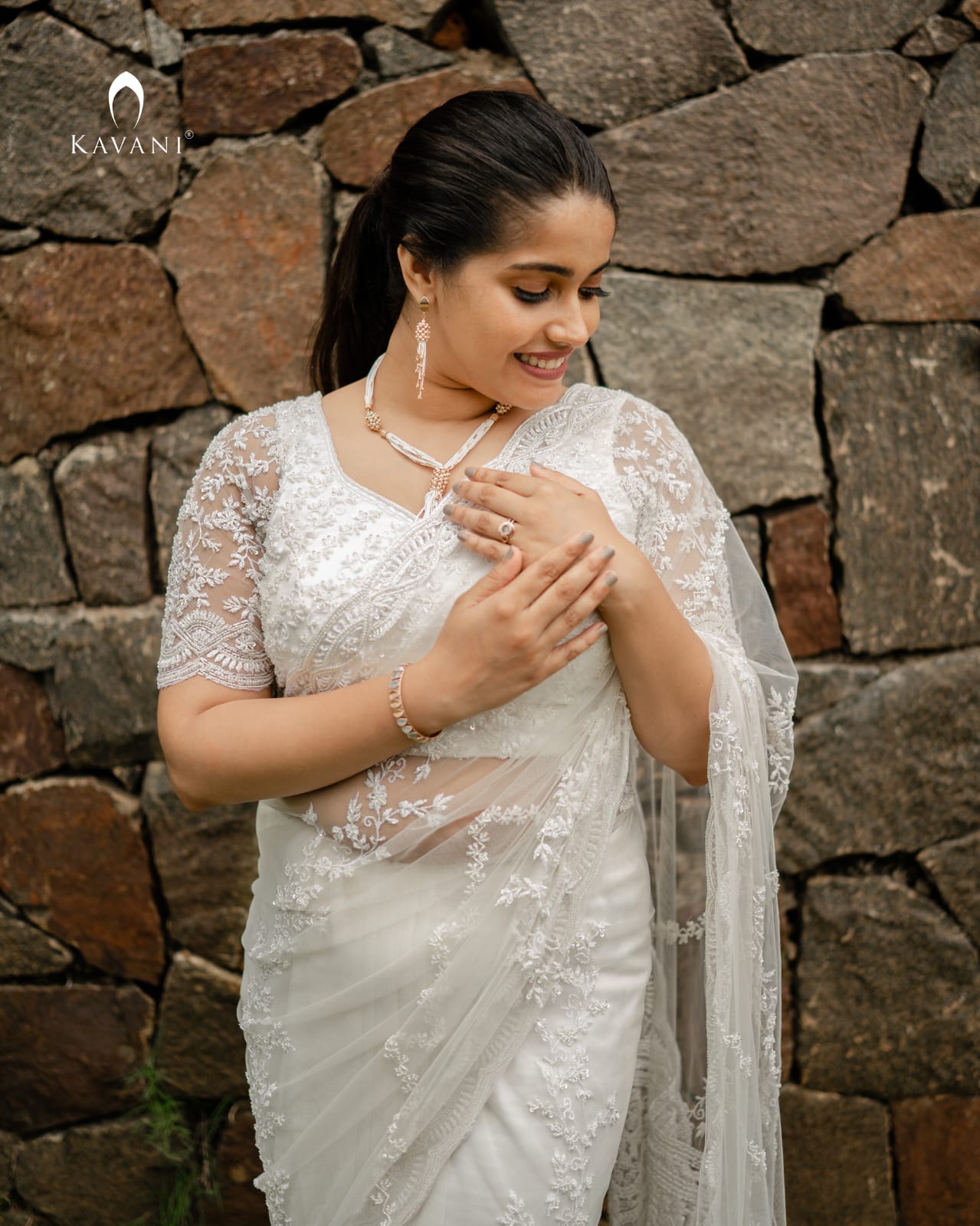 Our signature stunning white bridal saree showing beautiful lace embroidery with embellishments