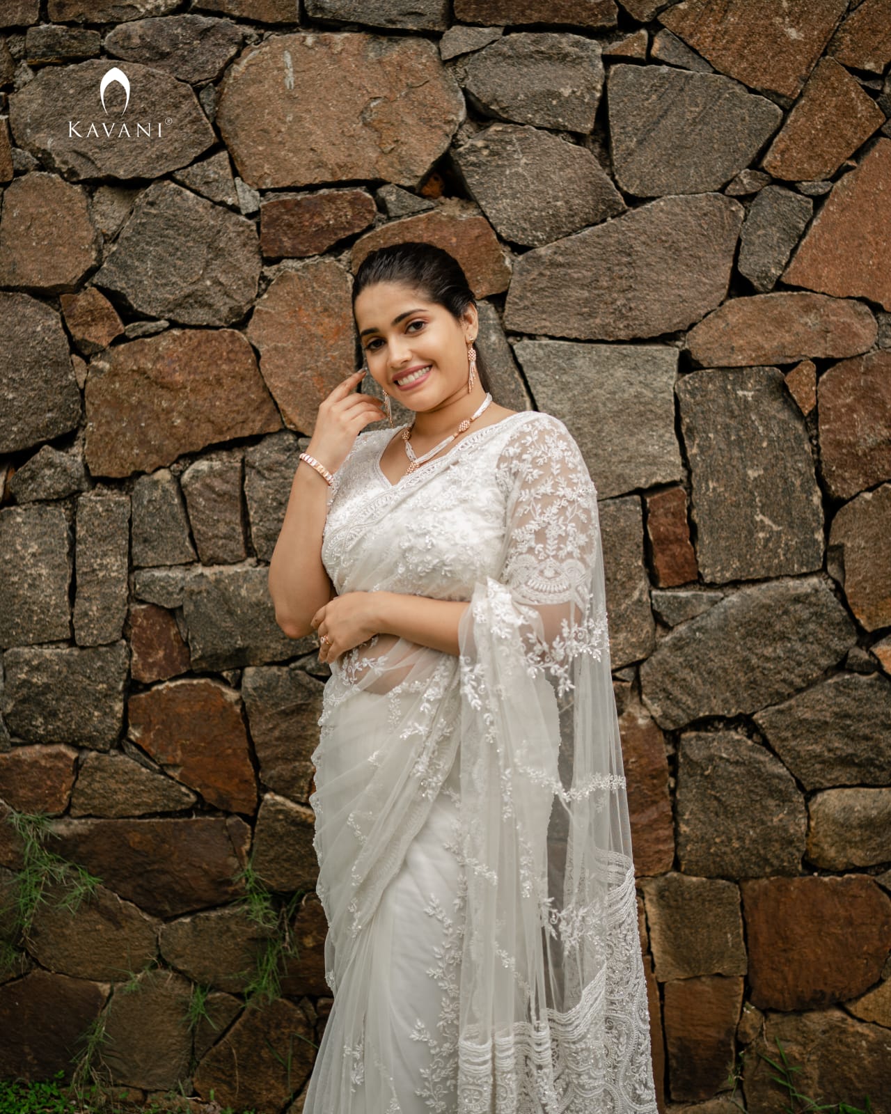 Our signature stunning white bridal saree showing beautiful lace embroidery with embellishments