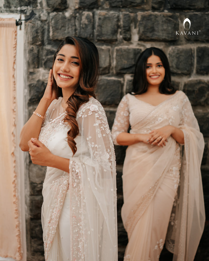 Our signature designer bridal off white saree with hand embroidery with a little pink and rosgold work