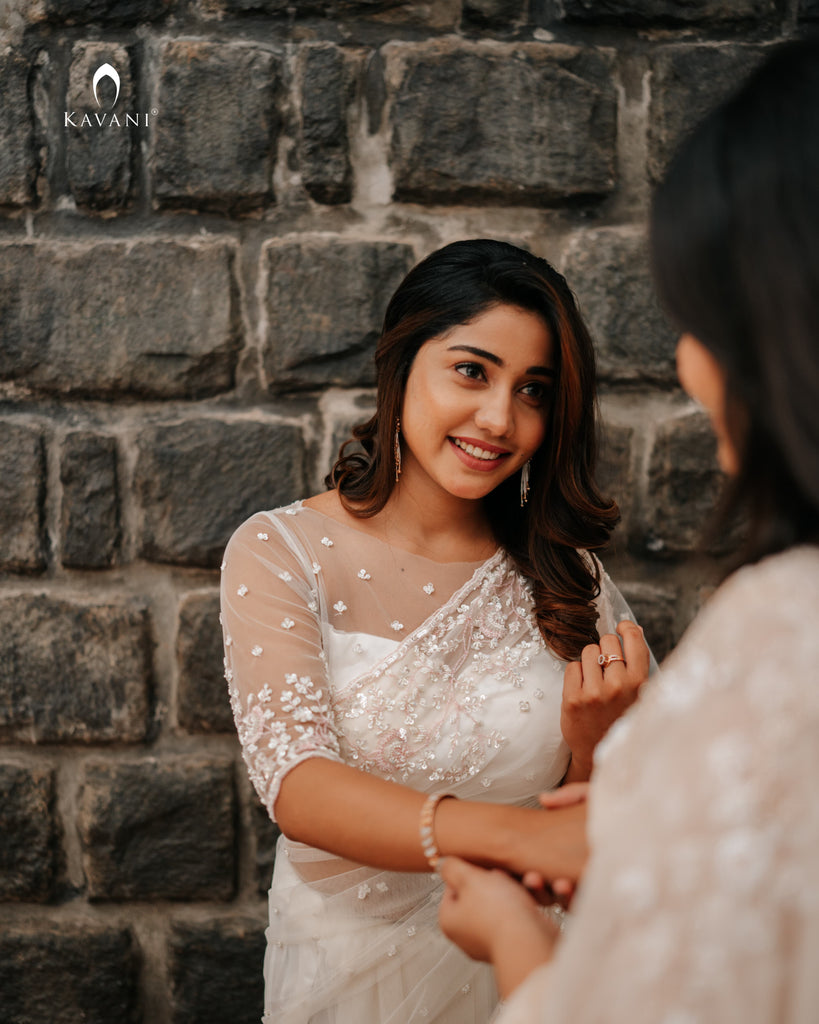 Our signature designer bridal off white saree with hand embroidery with a little pink and rosgold work