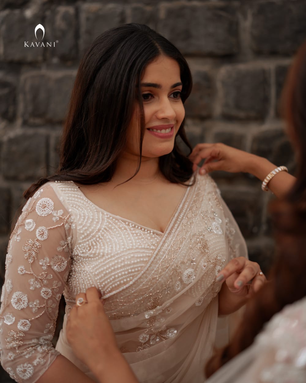 Our signature designer bridal saree with beautiful hand embroidery and a beaded worked blouse