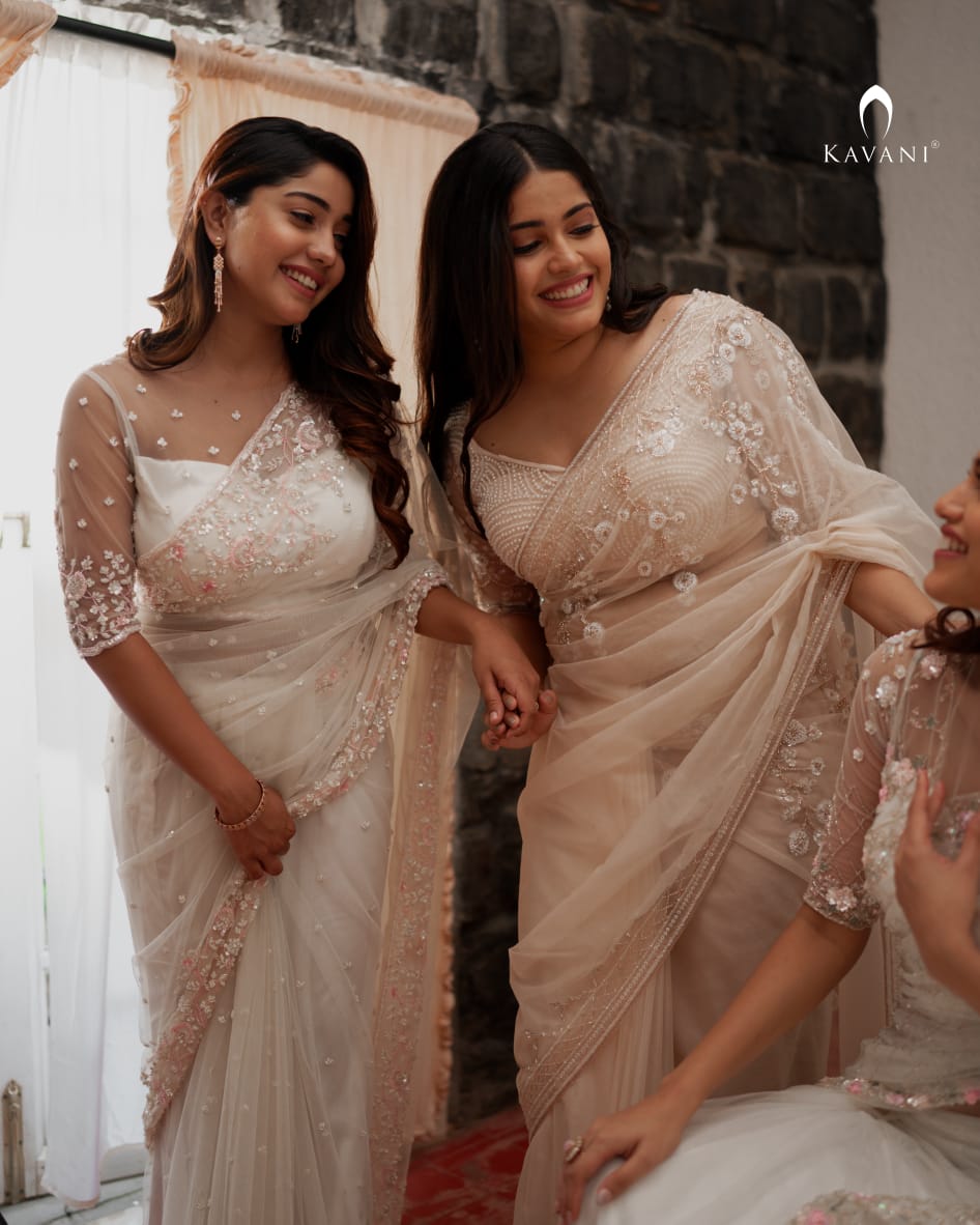 Our signature designer bridal saree with beautiful hand embroidery and a beaded worked blouse