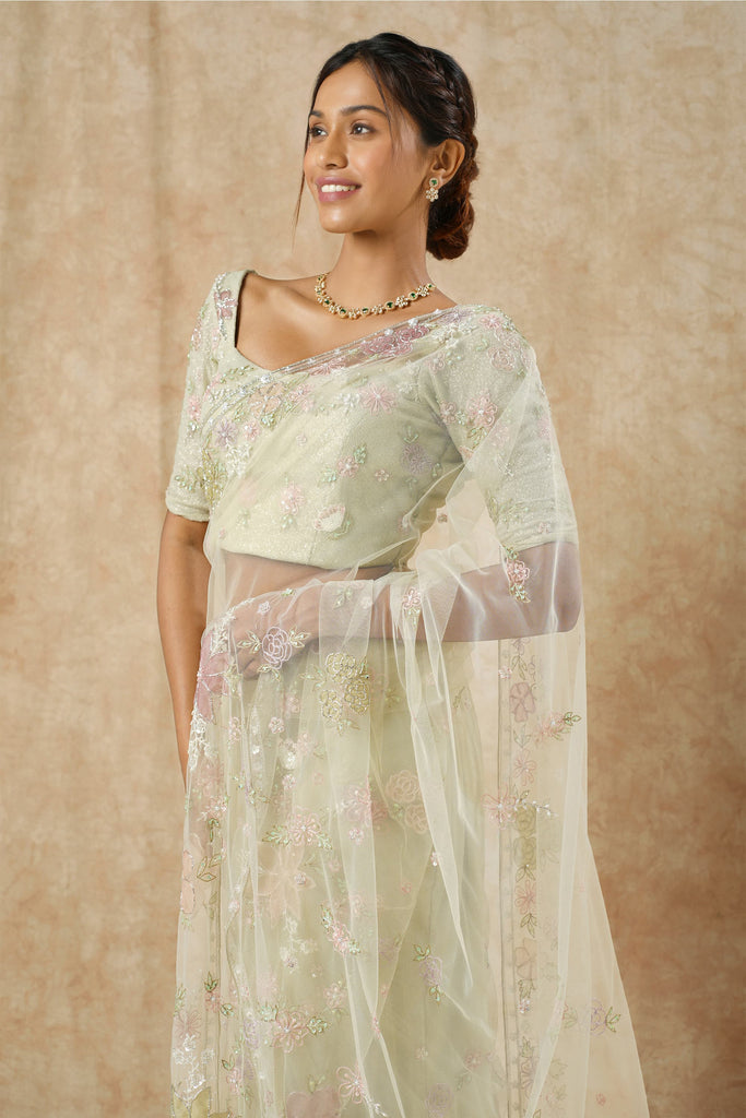 Enchanting Sage Green Net Saree with Multicolor Floral Appliqué & Beaded Detailing