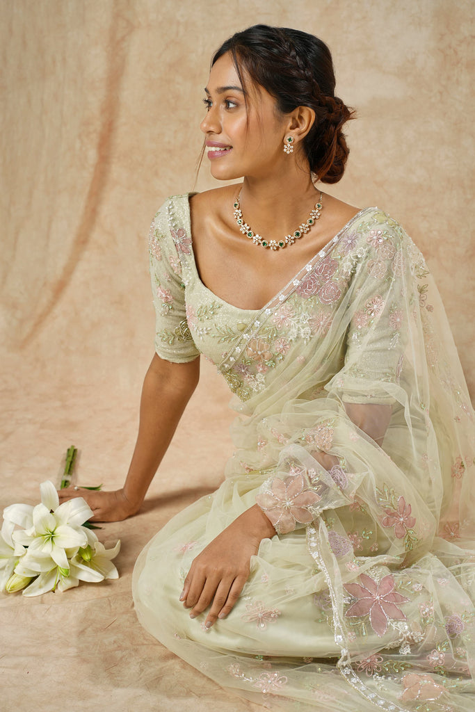 Enchanting Sage Green Net Saree with Multicolor Floral Appliqué & Beaded Detailing