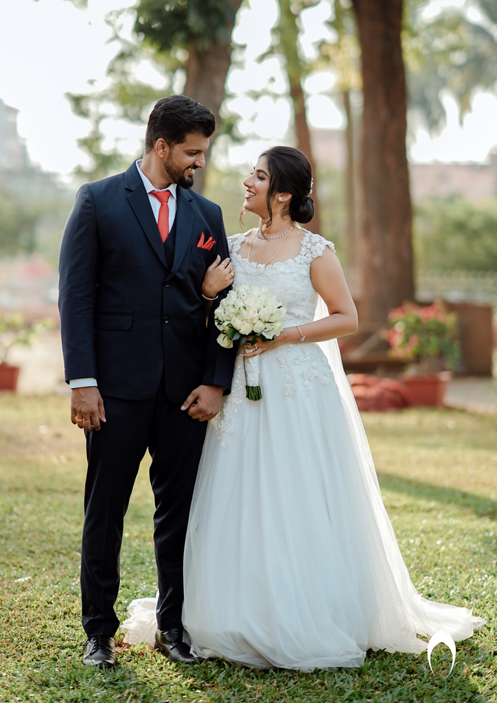 Signature Christian bridal A-line gown in net carried by bride Elizabeth