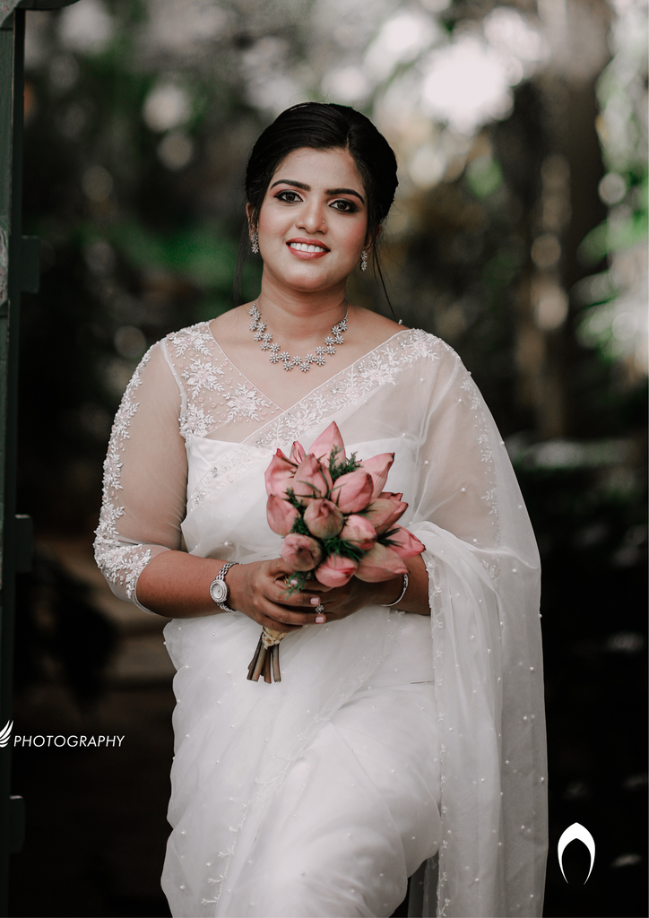 Signature Christian bridal floral hand embroidered organza saree with elegant border work