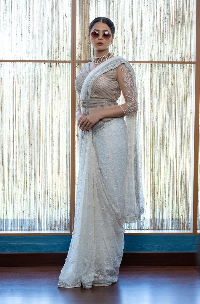 signature Christian bridal Off-white saree with lace work over georgette