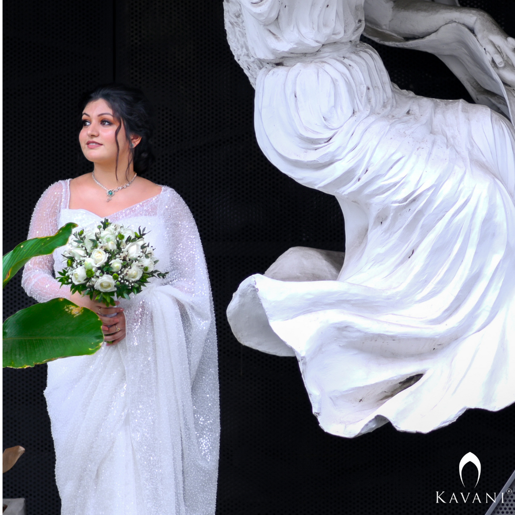 Our bride in her white bridal saree with sequence work with heavy hand embroidey