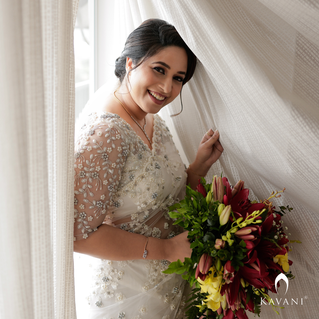 Our pretty bride in her stunning bridal saree with fully hand embroidered