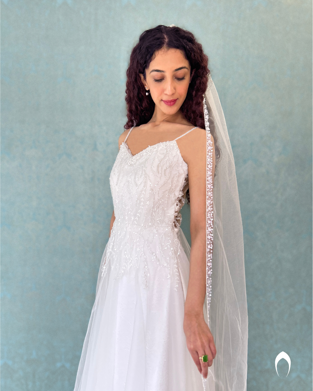 Signature  christian bridal Aline gown in net minimal flair and a spaghetti sleeve