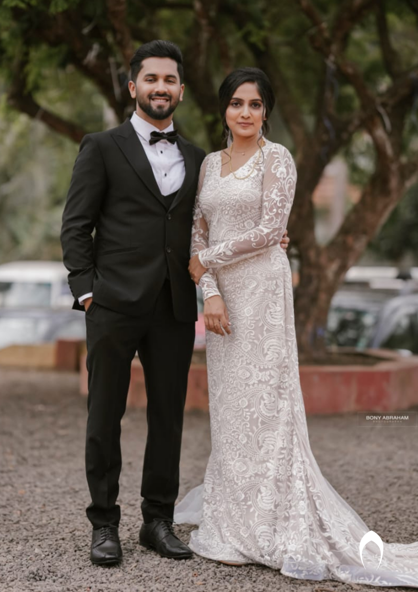 Signature christian bridal trailing champagne gown carried by bride Anuja