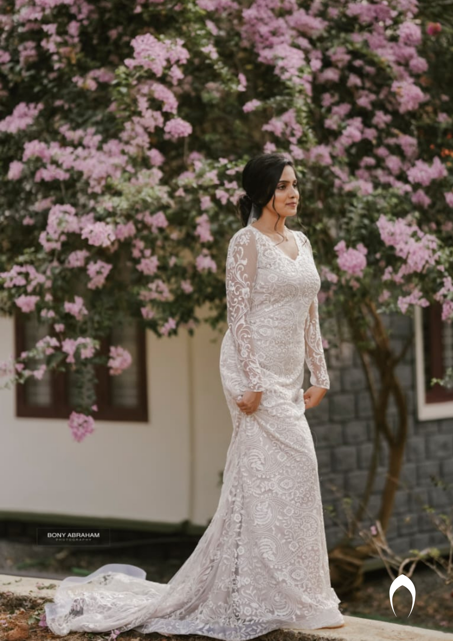 Signature christian bridal trailing champagne gown carried by bride Anuja