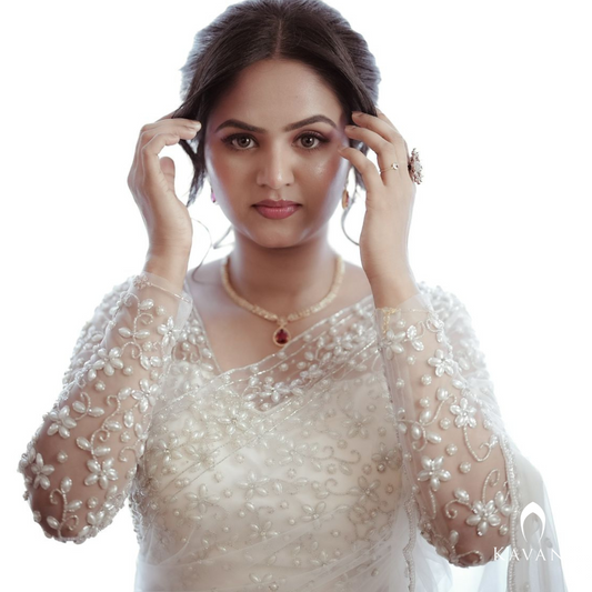 Our beautiful bride in her white bridal saree and elegant and stunning hand embroidery