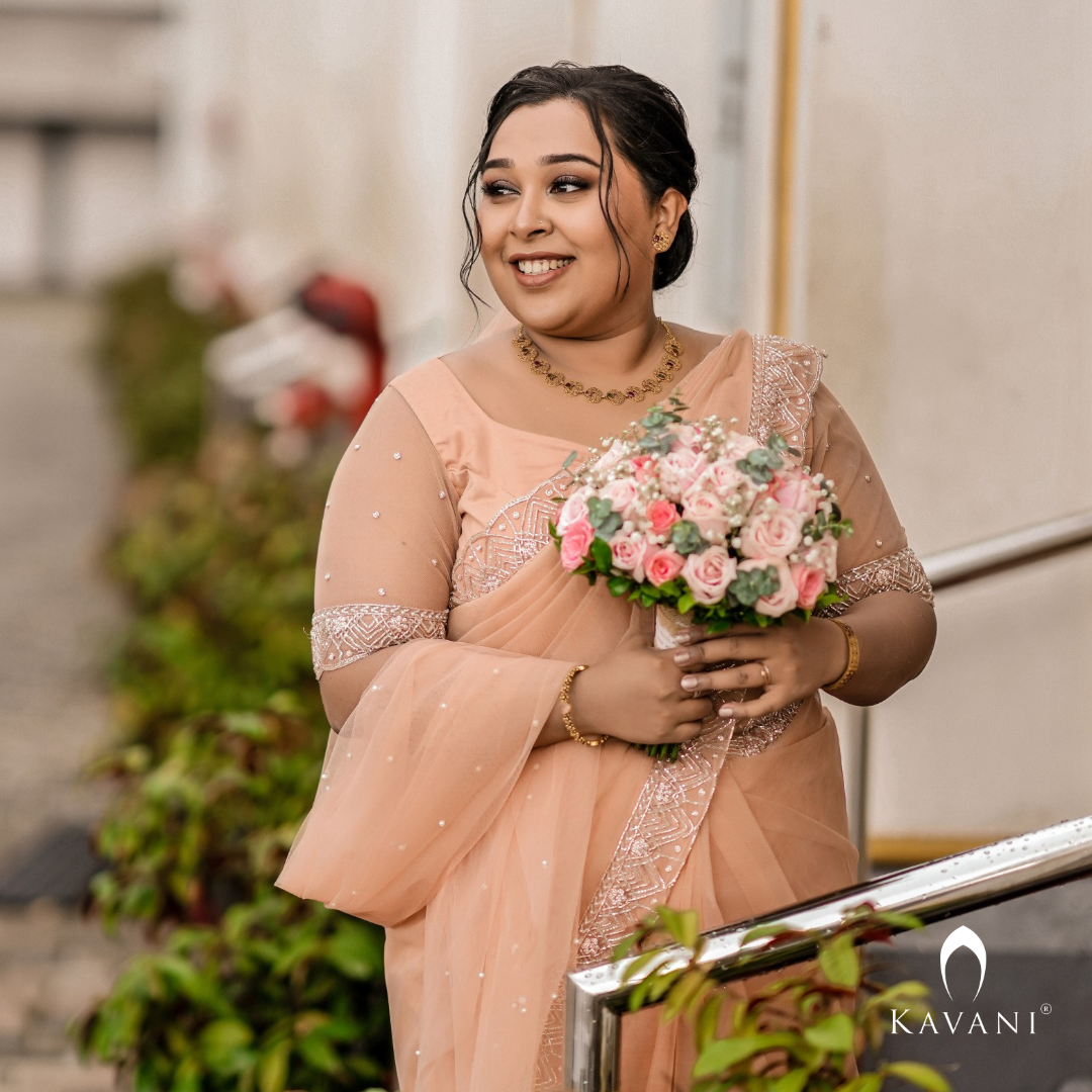 Our beautiful bride in her stunning hand embroidered pastel peach shade saree